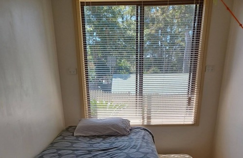 Batehaven House | Quiet House, amongst spotted gum trees, just minutes from beaches & shops.