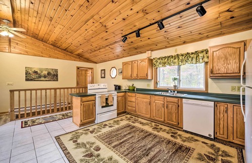 Dresser Cabin | Quiet Waterfront Round Lake Home w/Hot Tub
