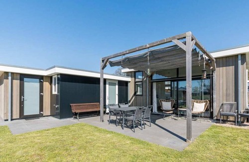 Burgh-Haamstede House | Real music lovers can indulge themselves here, as this chalet has a piano! From the living room you