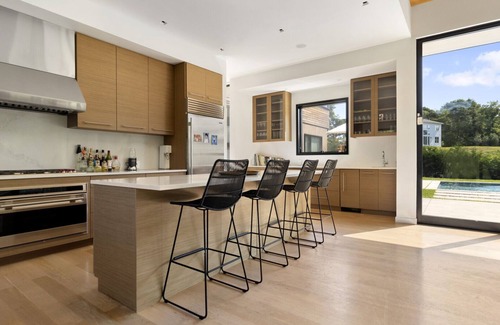 Shinnecock Hills House | Recently constructed modern-style home with a gated entrance, private pool,.