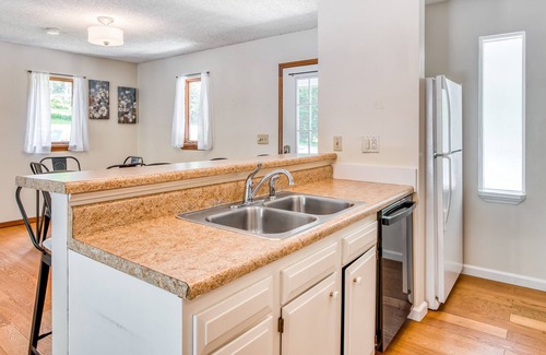 Royal Pines House | Recently renovated home in quiet location with decks, WiFi, fireplace, AC, & W/D