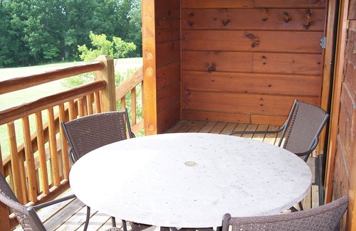 Spencer Cabin | Recline in the room in front of the fireplace with your PET