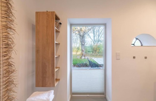 Tetenbull House | reetgedecktes Ferienhaus mit Kachelofen