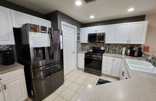 Cascades House | Refreshing Lake View Home in Upscale Estero Community