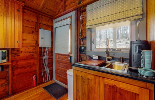 South Casco Apartment | Refurbished waterfront 1950s cabin with sauna, firepit, grill & kayaks - dogs ok