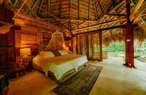 Samana Cabin | Regenerative tropical lodge with chic details , steps away from the beach.