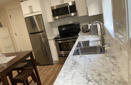Guildford House | Relax and recharge in our large 2 bedroom basement suite with private entrance