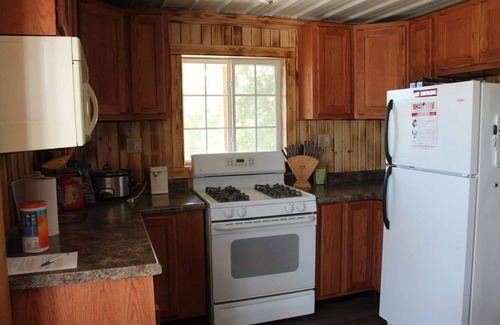 Thompsonville Cabin | Relax at Pond View Loft—your cozy barn-top retreat with pond views, fires, and fishing fun.