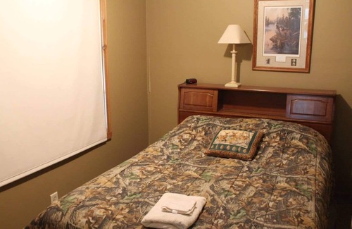 Thompsonville Cabin | Relax at Pond View Loft—your cozy barn-top retreat with pond views, fires, and fishing fun.