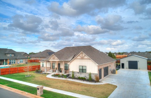 Yukon House | Relax & enjoy large private backyard with pool, hot tub & golf green!