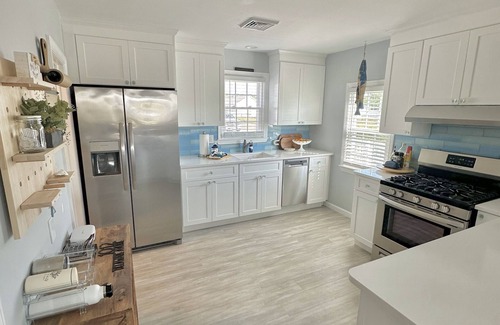 Villas Cottage | Relax here with beach views, steps to the beach, fenced in yard, pet friendly