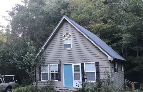 Marshall Cottage | Relax in a hammock chair to the sounds of Mill Creek in Madison County, NC