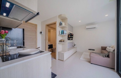 Patong Condo | Relax in a Spacious Deluxe King Room with Mountain &Distant Sea View