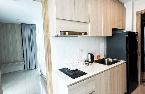 Patong Condo | Relax in a Spacious Deluxe King Room with Mountain &Distant Sea View