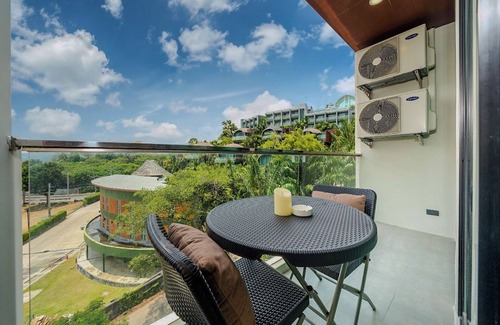 Patong Condo | Relax in a Spacious Deluxe King Room with Mountain &Distant Sea View