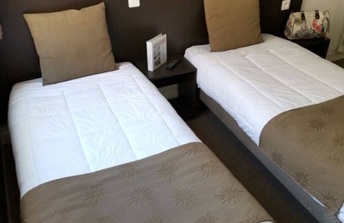 Lourdes Hotel | Relax in Comfort, Pet-Friendly, Free Parking, Onsite Restaurant, Scenic Views!