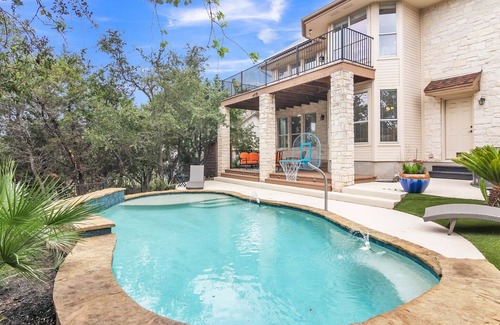 Travis Landing House | Relax in our beautiful backyard pool. Hop on Lake Travis at nearby marinas