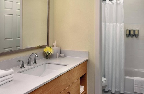 Somerset Hotel | Relax in Spacious Suite with Full Kitchen and Seasonal Swimming Pool