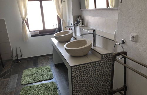 Tettnang Apartment | Relax in the large beamed bed/dream room. Guest room