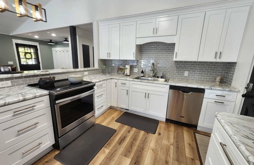 Eden Isle House | Relax & Recharge at The Nest – Lake Escape with Outdoor Fireplace & Hot Tub