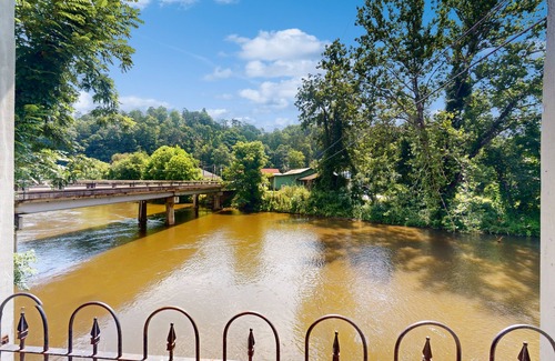Whittier House | Relax riverside at this serene mountain getaway, complete with modern comfort.