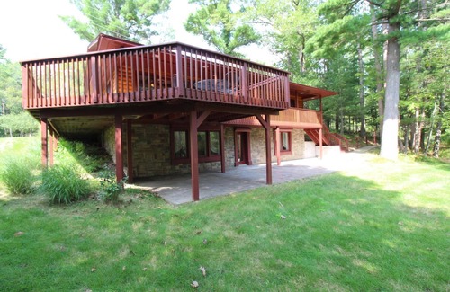 Grayling House | Relax, Unwind and Enjoy. Rustic log cabin with private Au Sable River Frontage!