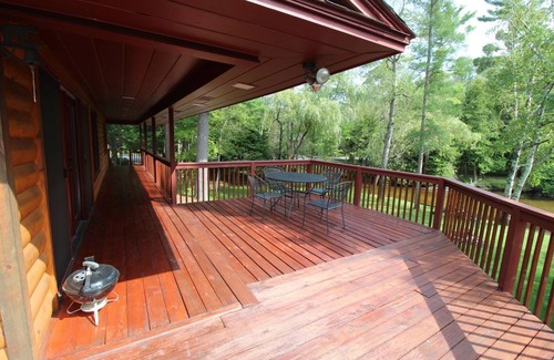 Grayling House | Relax, Unwind and Enjoy. Rustic log cabin with private Au Sable River Frontage!