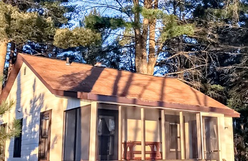 Presque Isle Cabin | Relaxing lake getaway with water views, on-site swimming, fishing, & boating