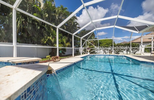 Pelican House | Relaxing outdoor with pool and hot tub!