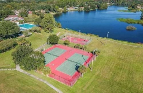 University House | Relaxing townhome with pool and lake