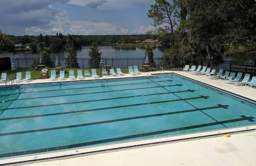 University House | Relaxing townhome with pool and lake