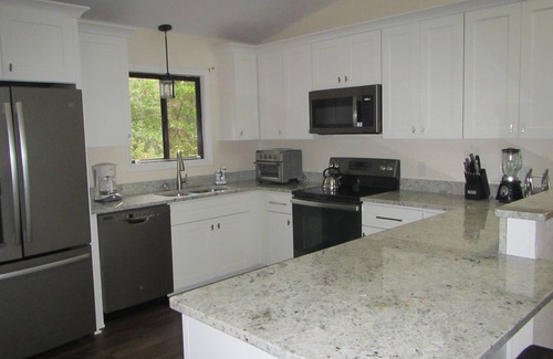 Manteo House | Remodeled cottage with plenty of outdoor space and privacy