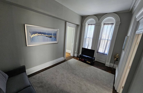 Oswego Apartment | Remodeled Historical Mansion Minutes from Oswego’s Best!