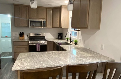 Edgerton House | Remodeled home with pontoon rental 2 decks Private beach playground volleyball