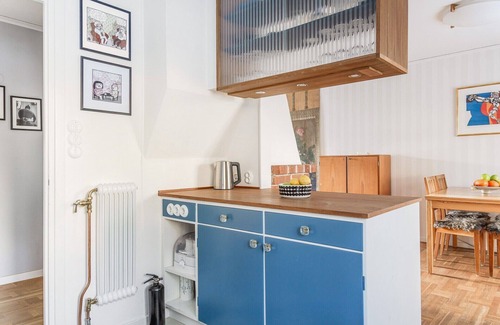 Skarpnack Apartment | Retro Retreat with Modern Comforts