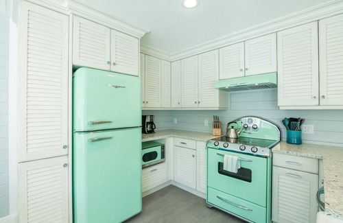 Holmes Beach Cottage | Retro Style Home with Large Pool Close to Downtown Holmes Beach and Walk to Beach!
