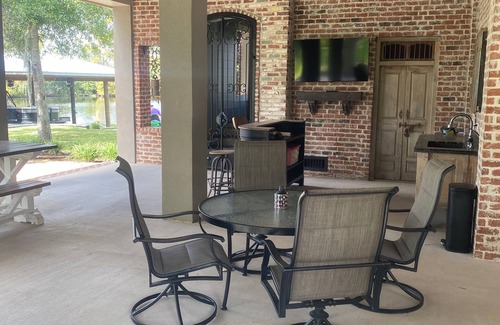 Lake Charles House | River front paradise with large dock and outdoor space, great for entertaining.