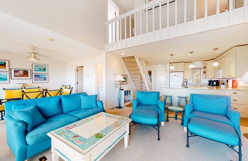Maple City Condo | Riverfront condo near the lake with beach access, fireplace, balcony & cable