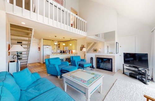 Maple City Condo | Riverfront condo near the lake with beach access, fireplace, balcony & cable