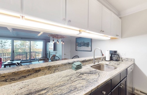 Glen Arbor Condo | Riverfront condo with beach access to lake, fireplace, furnished deck & cable