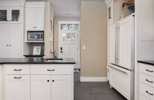 Pacific City House | Riverfront Dream is a luxurious 6 bedroom home on the bank of the Nestucca River.