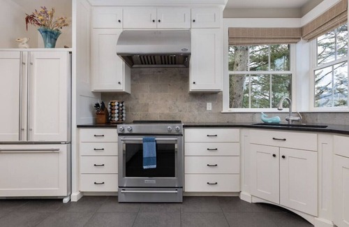 Pacific City House | Riverfront Dream is a luxurious 6 bedroom home on the bank of the Nestucca River.