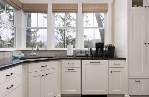 Pacific City House | Riverfront Dream is a luxurious 6 bedroom home on the bank of the Nestucca River.