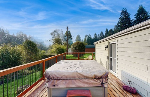 Crescent City House | Riverfront getaway with firepit, deck, fireplace, full kitchen, W/D, & WiFi