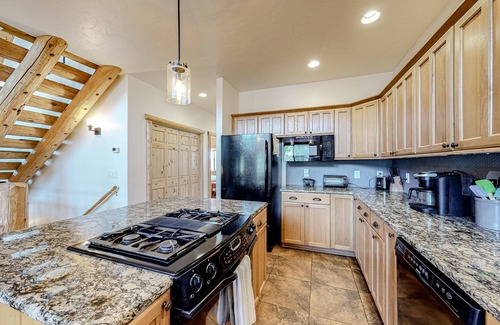 San Juan River Village House | Riverfront home with amazing mountain view, private hot tub, deck & fireplace