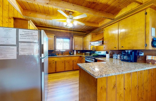 Rivers Edge House | Riverfront home with river & valley views, wood stove, deck, & W/D
