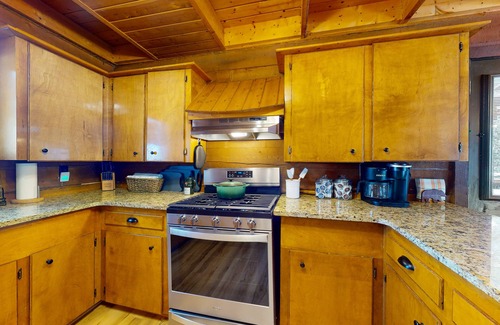 Rivers Edge House | Riverfront home with river & valley views, wood stove, deck, & W/D