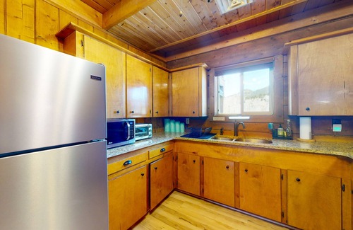 Rivers Edge House | Riverfront home with river & valley views, wood stove, deck, & W/D