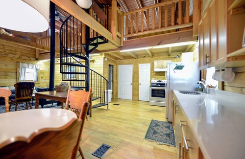 Millers Creek Cabin | Riverfront Log Cabin w/Private Waterfall, Firepit & Panoramic Deck