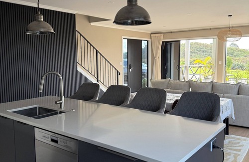Karaka House | Riverfront Pet Friendly Minimalist Karaka Stay – Close to Motorway